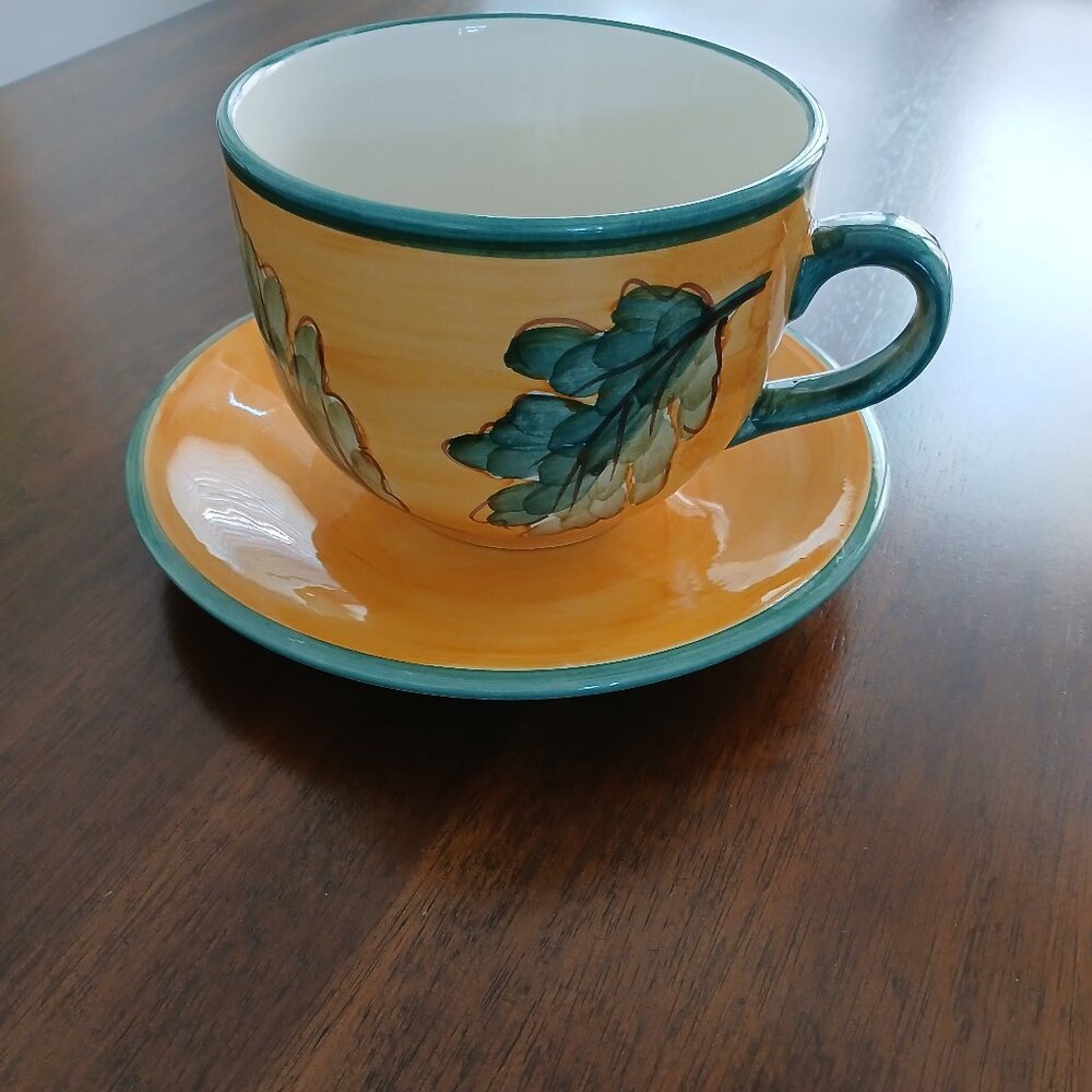 Large Yellow Ceramic Cup and Saucer with Green Leaves and Acorns
